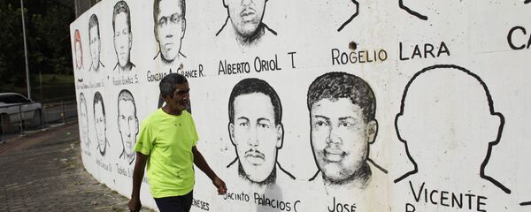Un mural con los rostros de los mártires asesinados en las protestas del 9 de julio de 1964 - Sputnik Mundo
