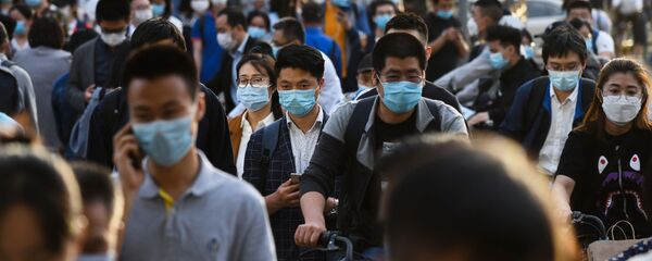 Gente en las calles de Pekín, China Gente en las calles de Pekín, China - Sputnik Mundo