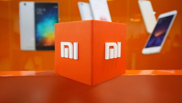 El logo de Xiaomi - Sputnik Mundo