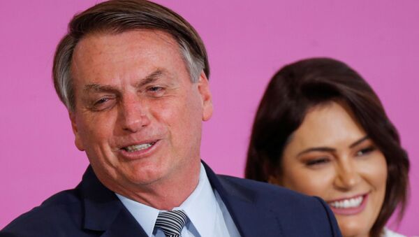  Jair Bolsonaro, presidente de Brasil, y Michelle Bolsonaro, su esposa - Sputnik Mundo