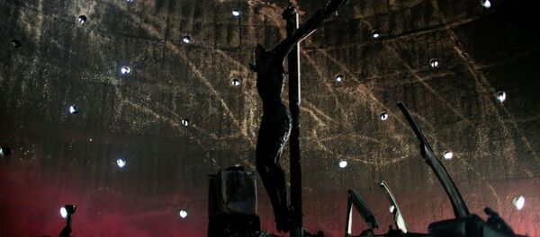 La imagen de la Sangre de Cristo después del incendio La imagen de la Sangre de Cristo después del incendio - Sputnik Mundo