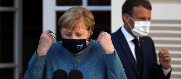 La canciller alemana, Angela Merkel, y el presidente francés, Emmanuel Macron - Sputnik Mundo
