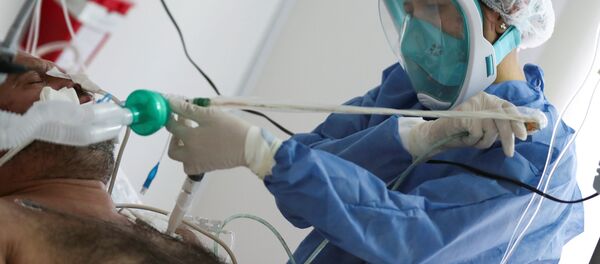 Un paciente con COVID-19 en un hospital de Buenos Aires, Argentina - Sputnik Mundo