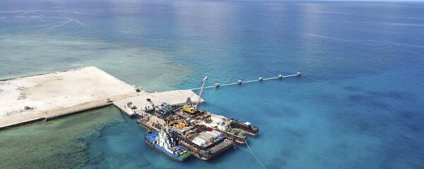 La isla de Pag-asa reclamada por Filipinas, también conocida como Thitu, en el disputado mar de la China Meridional - Sputnik Mundo