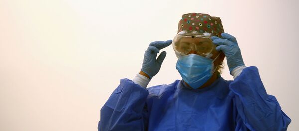 Una trabajadora de un hospital de Madrid, España Una trabajadora de un hospital de Madrid, España - Sputnik Mundo