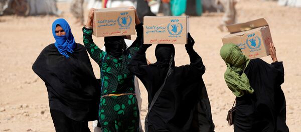 Mujeres sirias con la ayuda alimentaria del Programa Mundial de Alimentos (PMA) - Sputnik Mundo
