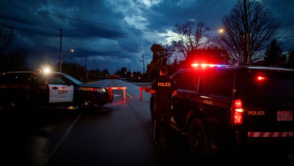 Policía canadiense - Sputnik Mundo