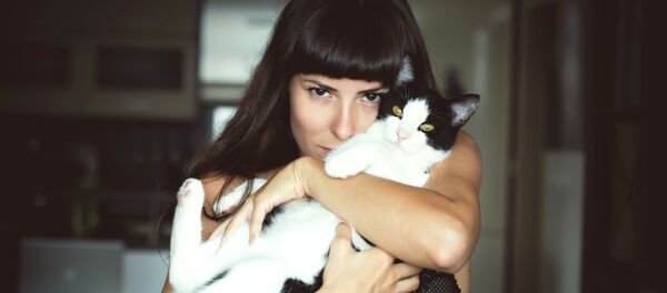 Dueña de un gato, imagen ilustrativa - Sputnik Mundo