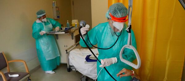 Médicos alemanes durante el brote de coronavirus - Sputnik Mundo