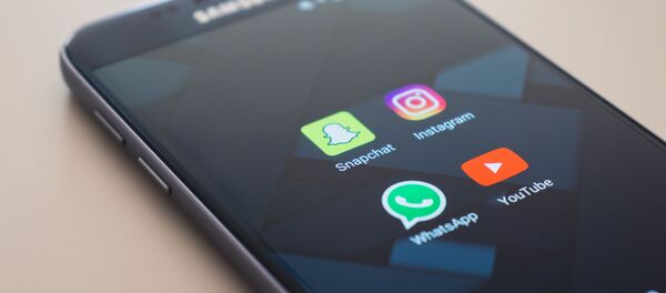 Un teléfono móvil (archivo) - Sputnik Mundo