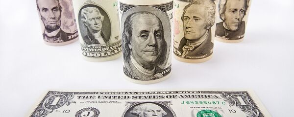 Varios dólares - Sputnik Mundo