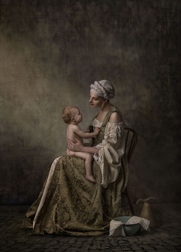 'A quiet connection' ('Una silenciosa conexión'), de la fotógrafa Nancy Flamea, obtuvo el tercer puesto en la categoría Family Sitting. - Sputnik Mundo