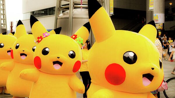 Personas vestidas de Pikachu (archivo) - Sputnik Mundo