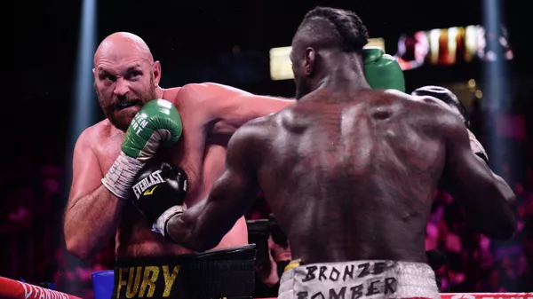 Los boxeadores Tyson Fury y Deontay Wilder - Sputnik Mundo