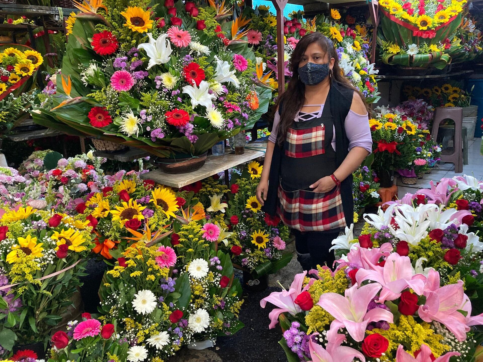 Comerciante de flores en el Mercado de Jamaica - Sputnik Mundo, 1920, 29.10.2021