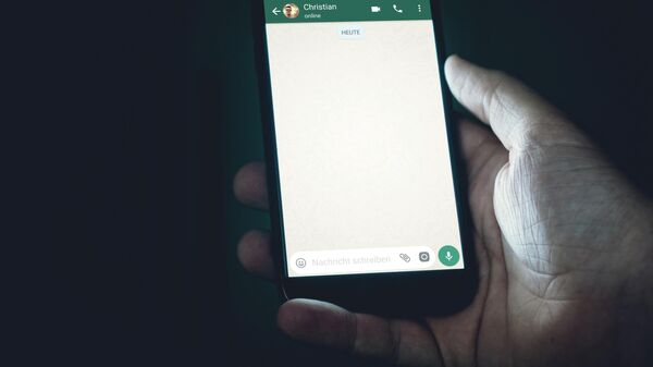 Pantalla de chat de WhatsApp - Sputnik Mundo