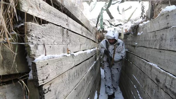Un miliciano de las fuerzas rebeldes de Lugansk, febrero del 2022 Un miliciano de las fuerzas rebeldes de Lugansk, febrero del 2022 - Sputnik Mundo