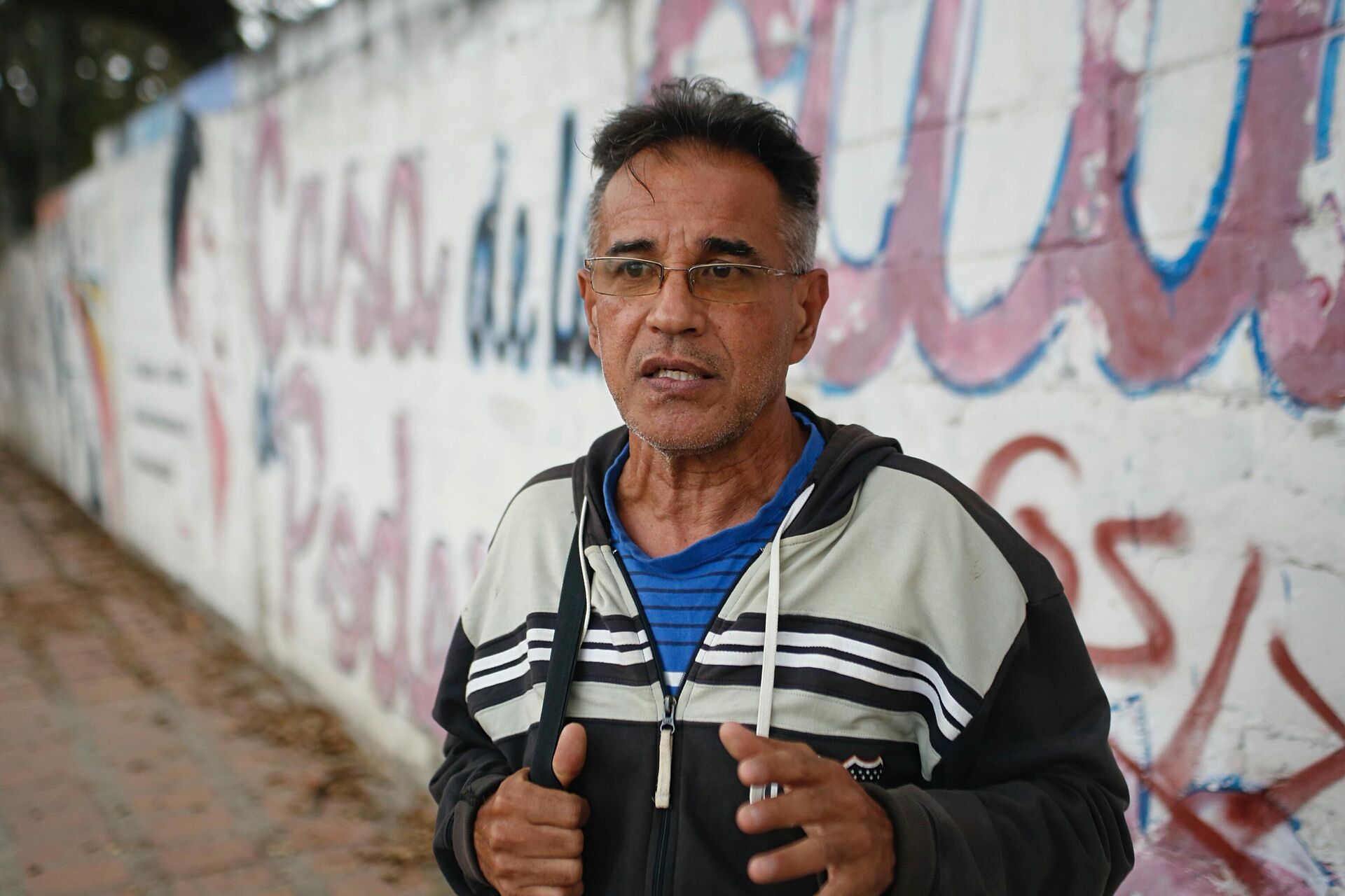 Frank León, militante popular en el barrio 23 de Enero en Caracas - Sputnik Mundo, 1920, 27.02.2022