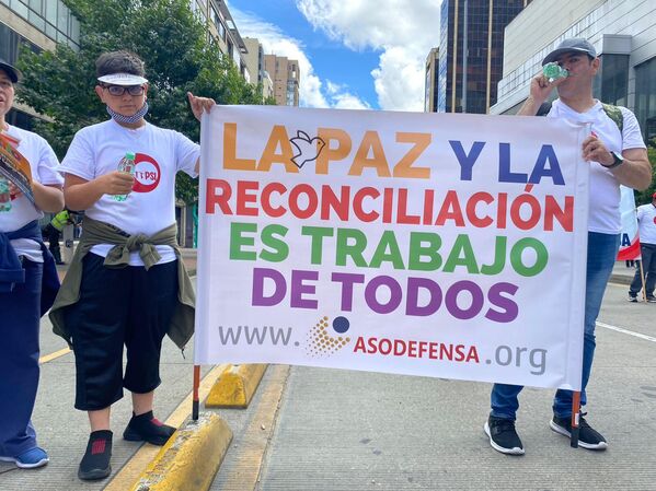 Asodefensa, sindicato del Ministerio de Defensa, también estuvo presente en la conmemoración y dejó su mensaje. - Sputnik Mundo