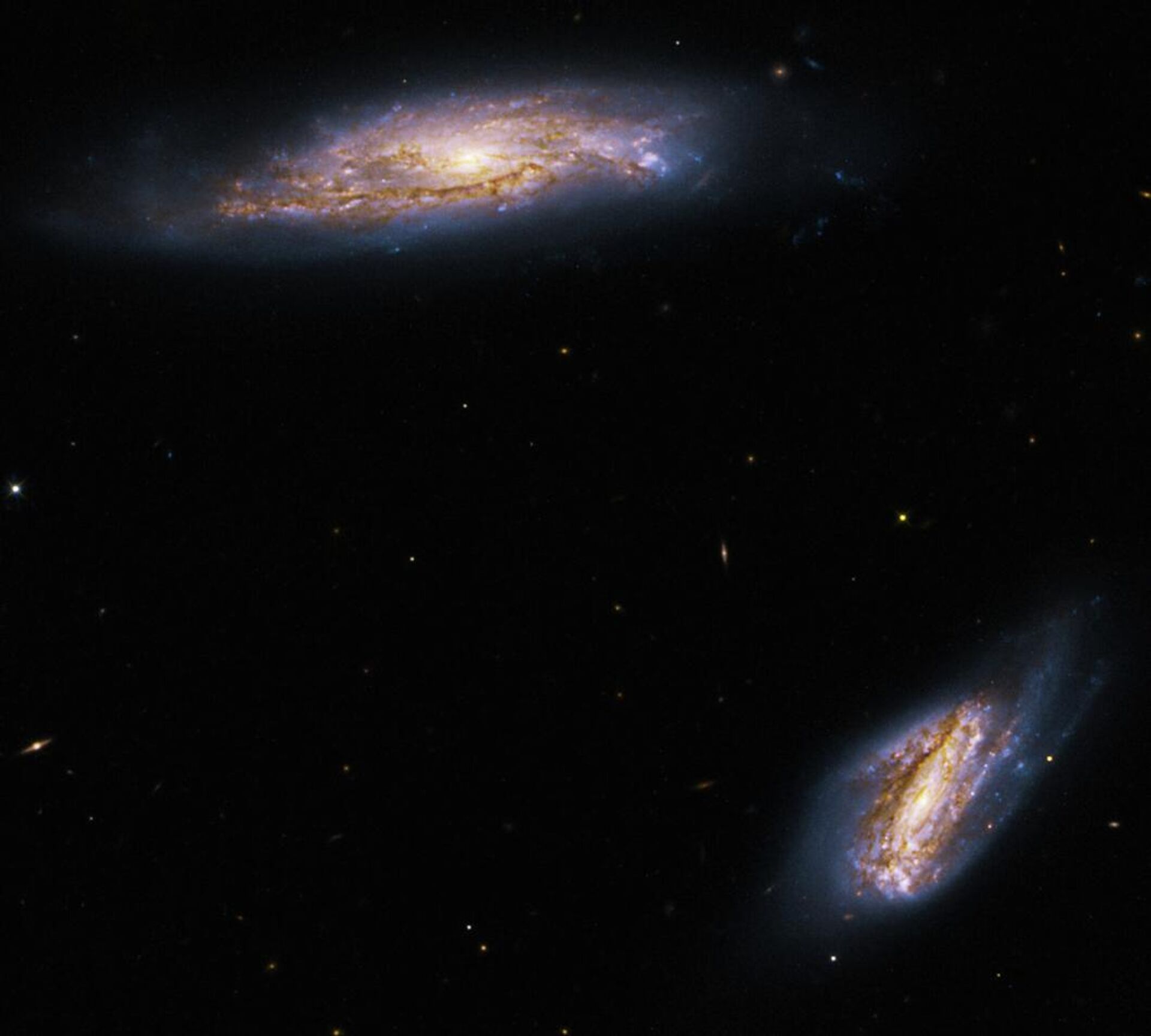 La foto de un par de espirales formadoras de estrellas conocidas como Arp 303 - Sputnik Mundo, 1920, 30.05.2022