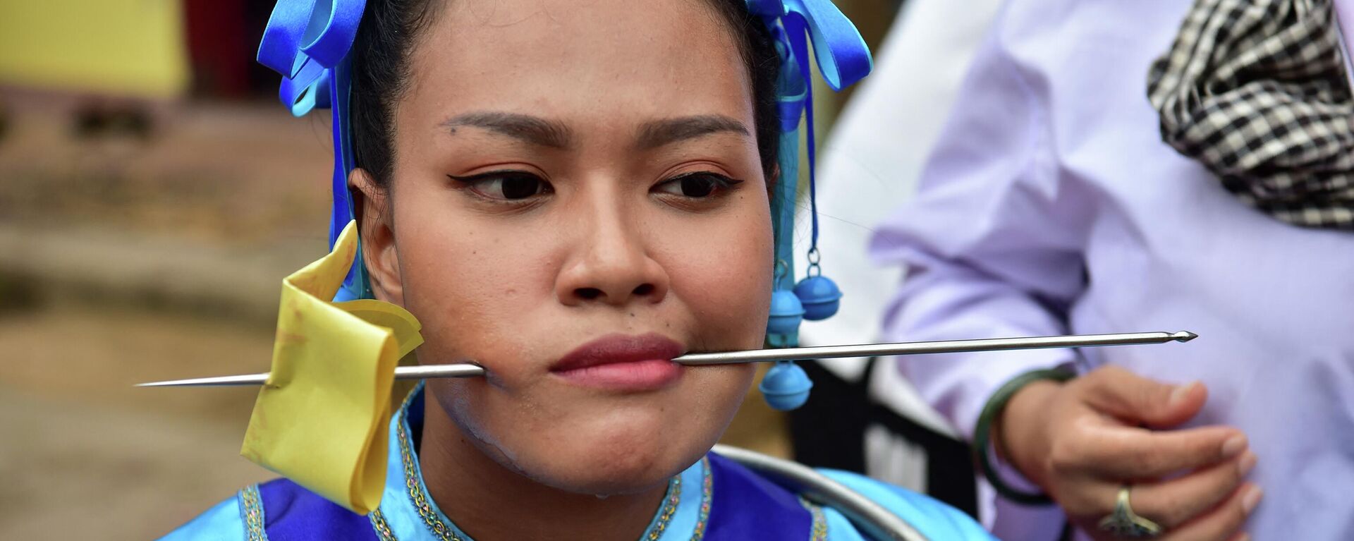 Una participante en el desfile dedicado a la diosa del templo Gow Lengchi en Narathiwat, al sur de Tailandia - Sputnik Mundo, 1920, 13.07.2022