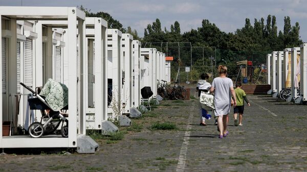 Refugiados por el conflicto en Ucrania en una instalación temporal en Berlín, Alemania, en agosto de 2022 - Sputnik Mundo
