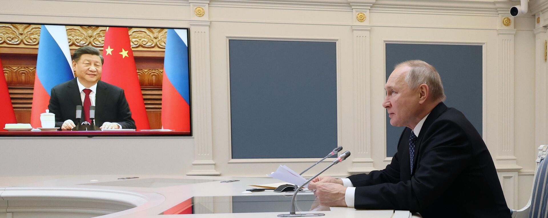 Xi Jinping, presidente de China, y Vladímir Putin, presidente de Rusia, durante una videoconferencia - Sputnik Mundo, 1920, 31.12.2022