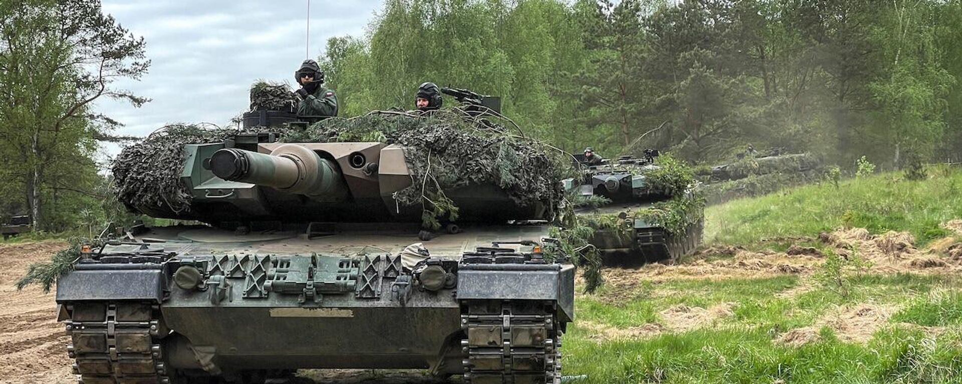 Tanques Leopard 2A durante una maniobra en Polonia coordinada con EEUU. - Sputnik Mundo, 1920, 24.02.2023