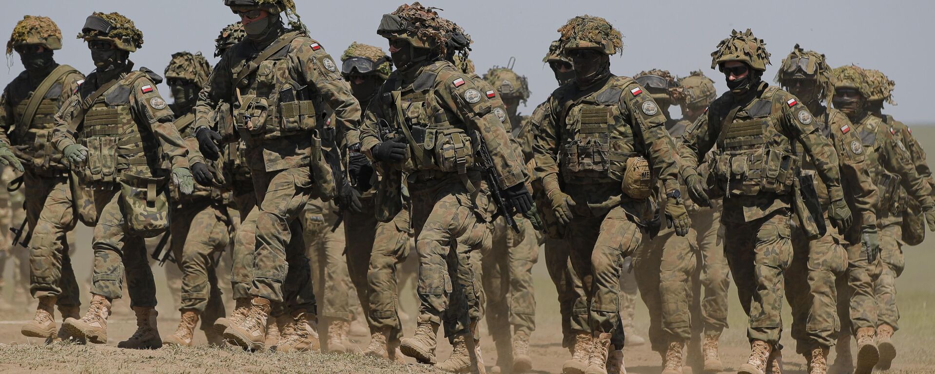 Tropas polacas marchan tras el ejercicio Justice Sword 21 en el campo de tiro militar de Smardan, Rumania, el 11 de mayo de 2021 - Sputnik Mundo, 1920, 30.04.2025