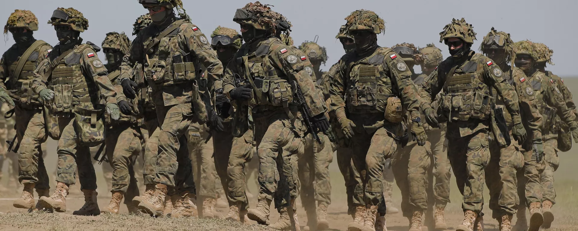 Tropas polacas marchan tras el ejercicio Justice Sword 21 en el campo de tiro militar de Smardan, Rumania, el 11 de mayo de 2021 - Sputnik Mundo, 1920, 30.04.2025