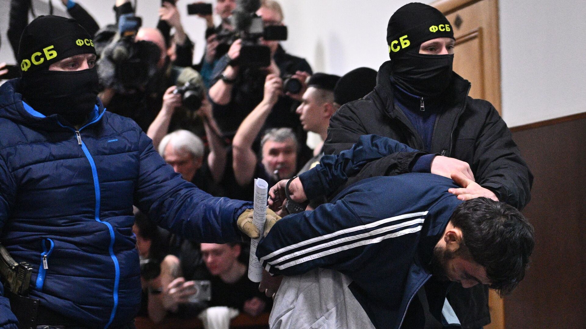 Dalerdzhón Mirzóev, detenido como sospechoso del acto terrorista en el Crocus City Hall, en el edificio del Tribunal Basmani de Moscú Dalerdzhón Mirzóev, detenido como sospechoso del acto terrorista en el Crocus City Hall, en el edificio del Tribunal Basmani de Moscú - Sputnik Mundo, 1920, 29.06.2025