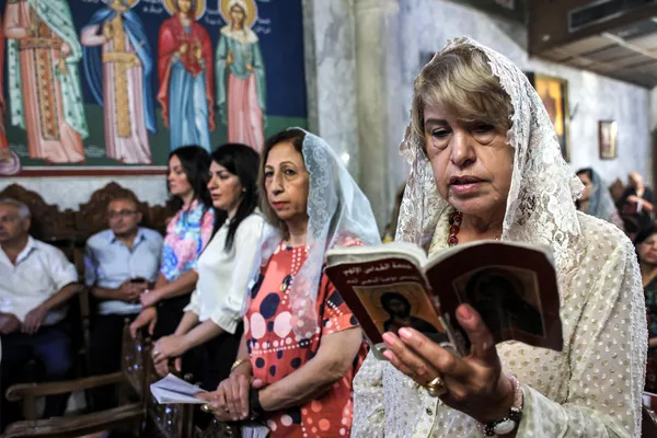 Fieles cristianos asisten a la misa del Domingo de Ramos en la iglesia ortodoxa griega de San Porfirio en Gaza. Fieles cristianos asisten a la misa del Domingo de Ramos en la iglesia ortodoxa griega de San Porfirio en Gaza. - Sputnik Mundo