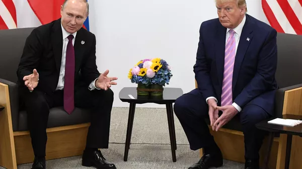 El encuentro del presidente de Rusia, Vladímir Putin, y su homólogo estadounidense, Donald Trump, el 28 de junio de 2019 - Sputnik Mundo
