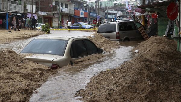 Las inundaciones afectan a gran parte de los países. Esta es una imagen tras el huracán John, en México. - Sputnik Mundo