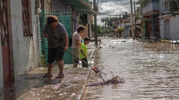 Aumenta la cifra de los fallecidos por las intensas lluvias en México - Sputnik Mundo