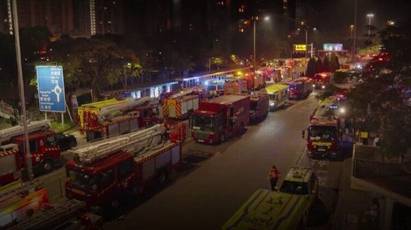 Van 128 fallecidos a causa del incendio de un edificio en Hong Kong - Sputnik Mundo