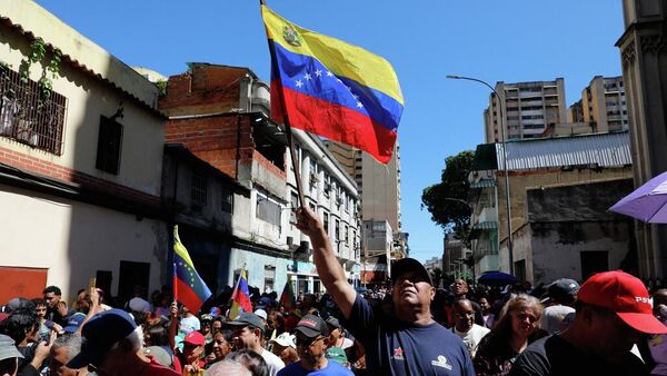 Una protesta en contra de la injerencia de EEUU en Venezuela el 13 de diciembre de 2025 - Sputnik Mundo