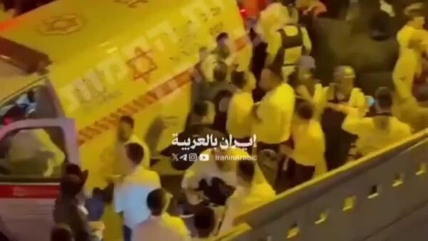 El servicio de ambulancias israelí reportó dos muertos y varios heridos en Ramat Gan, próxima a Tel Aviv, tras ataques con misiles provenientes de Irán - Sputnik Mundo