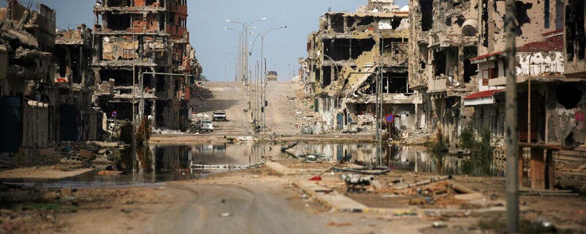 Una vista general de los edificios devastados por los combates en Sirte, Libia - Sputnik Mundo, 1920, 19.03.2026