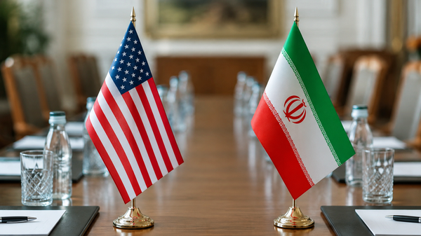 Las banderas de EEUU e Irán en la mesa de negociaciones (Imagen referencial) - Sputnik Mundo