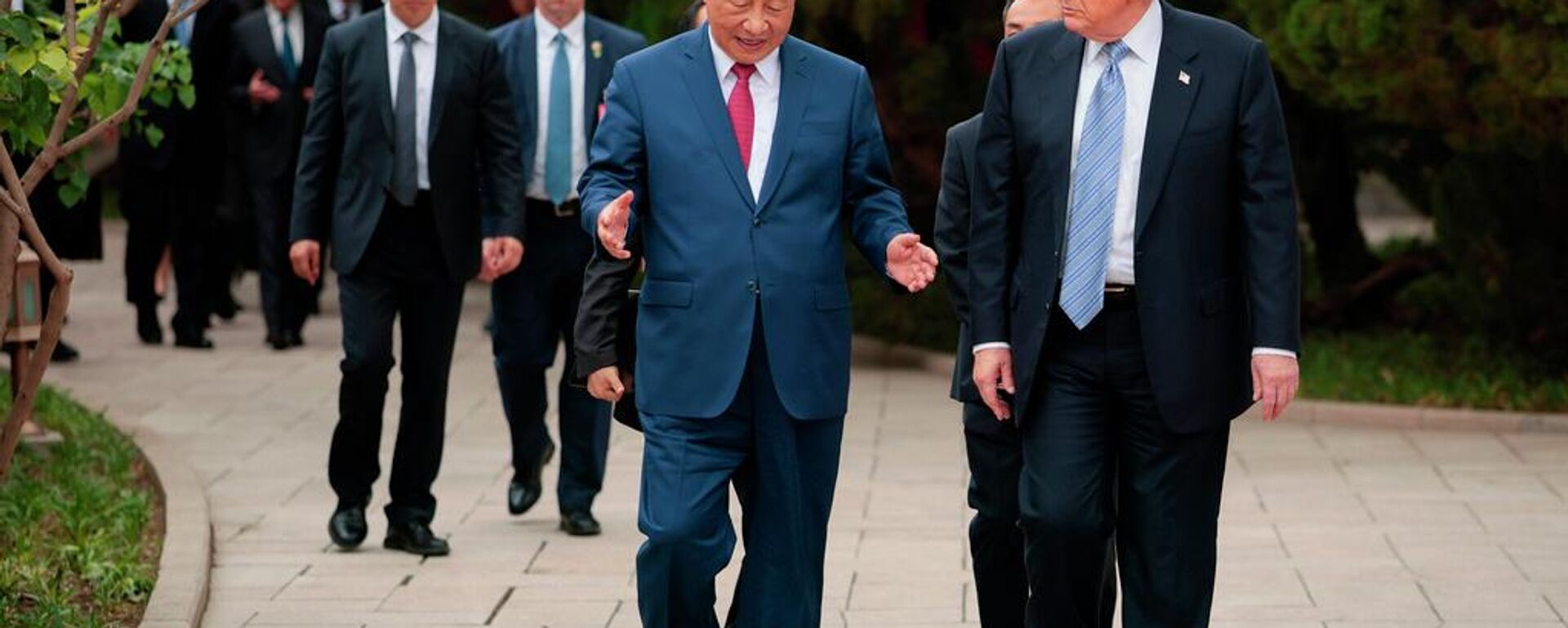 El presidente de EEUU, Donald Trump, y su homólogo de China, Xi Jinping, en Pekín - Sputnik Mundo, 1920, 17.05.2026