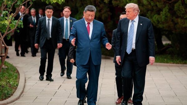 El presidente de EEUU, Donald Trump, y su homólogo de China, Xi Jinping, en Pekín - Sputnik Mundo