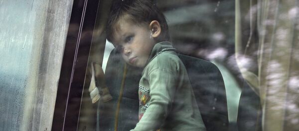 Refugiados ucranianos - Sputnik Mundo