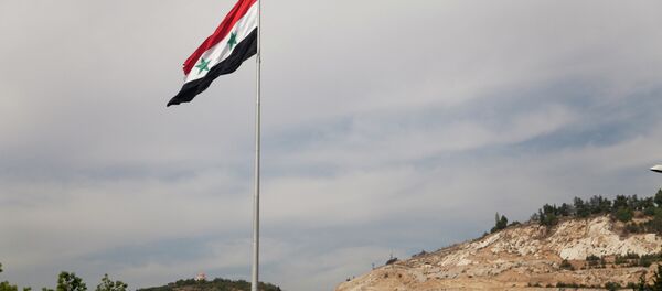 Syrian flag over the capital, Damascus, Syria - Sputnik Mundo