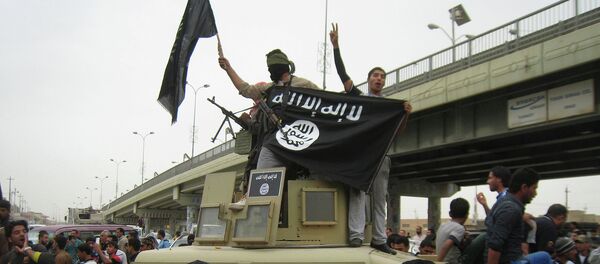 Militantes del grupo yihadista Estado Islámico (EI) - Sputnik Mundo