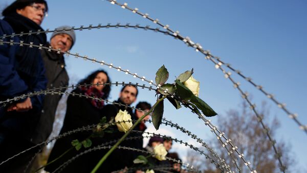 Ceremony in Madrid, marking the first anniversary of the deaths of 14 African migrants who drowned at Tarajal beach , February 6, 2015 - Sputnik Mundo