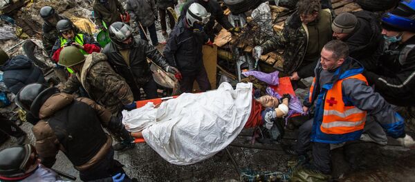 Manifestante herido en la Plaza de la Independencia (Maidán) de Kiev, 2014 - Sputnik Mundo