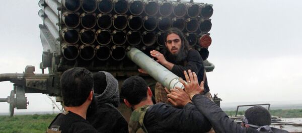 Rebel fighters of the Al-Furqan brigade prepare Grad rockets to be launched towards forces loyal to Syria's President Bashar Al-Assad stationed in Salhab village, from the orchards of the west of al-Zukat village Rebel fighters of the Al-Furqan brigade prepare Grad rockets to be launched towards forces loyal to Syria's President Bashar Al-Assad stationed in Salhab village, from the orchards of the west of al-Zukat village - Sputnik Mundo