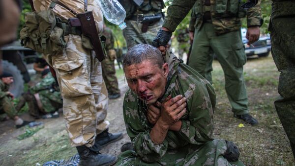 Foto de Andréi Stenin en que aparece un militar ucraniano hecho prisionero por milicianos durante los combates por la ciudad de Shajtiorsk, en Donbás - Sputnik Mundo