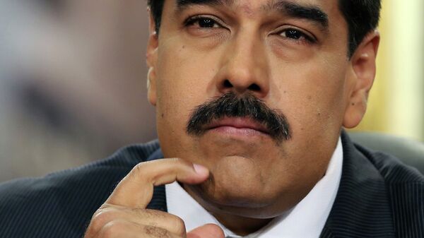 Venezuela's President Nicolas Maduro pauses during his speech at a press conference at Miraflores Presidential Palace in Caracas, Venezuela, Tuesday, Dec. 30, 2014 - Sputnik Mundo